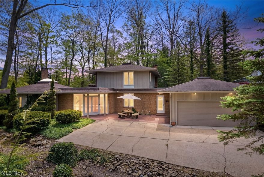 A whimsical, portrait of a Tanglewood Lake/Golf Community 4/3 home sits beside a verdant golf course, blending mid-century charm w/modern livability. The foyer greets w/cathedral ceiling & clean, minimalist lines that feel both retro & inviting. A 1st-flr bdrm w/ full bath adds practicality. The living rm is bathed in sunshine from expansive windows & sliders that frame the outdrs, w/beam ceilings & parque wd flrs adding warmth & texture. A brick frplc serves as a characterful focal point, anchoring convos that drift across the rm. The DR steps up & is wrapped in a wall of windows that floods the space with nat glow, flowing seamlessly into a galley kitchen w/SS appliances, efficient yet welcoming. A sun rm/breakfast rm has skylights & wall of windows invites plants, coffee & casual meals keeping the space connected to the GR, which ties the entire main level beneath vaulted ceilings. Surround windows & Art déco frplc. A sun porch off the living area, screened to invite gentle breezes, overlooks a spectacular wooded lot & distant 15th hole, delivering a sense of serene leisure. 2nd level features the primary suite offering a balcony w/views over the serene property & golf course, a calming retreat bathed in nat light, walk-in & en-suite. 2 add. bdrms & full bath provide ample space for family & guests. The LL is ready to be transformed into spaces that fit yr lifestyle. Historically Tanglewood Lake community enhances this elegant retreat w/18 hole public golf coarse, clubhouse that hosts social events & activities year-round, well-manicured common areas, walking paths weaving thru picturesque greens. Residents enjoy access to a serene beach/lake, tennis & pickleball, picnic areas for outdoor gatherings. The neighborhood offers a true blend of private comfort and communal vitality, it pairs tranquil natural beauty w/ a welcoming active lifestyle. Call LA for a private tour & more info.