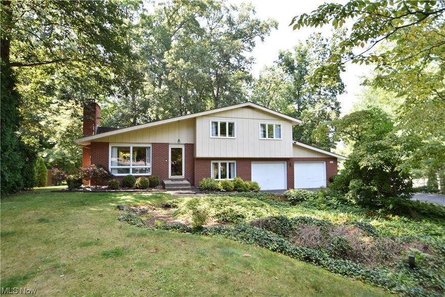 The backyard is a little piece of Paradise ! Sitting on the 16x40 deck with natural gas firepit and barbecue you look at the wooded lot with a creek and small pond. Multiple bird feeders attract rare Baltimore Orioles, Red headed woodpeckers and hummingbirds. Improvements include driveway sealed, house exterior power washed, wood deck painted (2023), granite counter tops (2020), gutters (2021), hardwood floors refinished (2010). Cedar wood lined closet in Rec room.