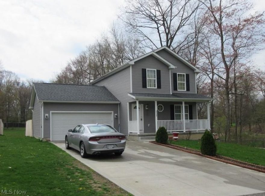 Be the proud owner of this newer colonial, energy efficient home built in 2015! This home has 3 bedrooms, 2 full baths (second floor) and a large 1/2 bath(first floor). There is a VERY spacious eat-in kitchen with nice cabinets,a pantry, laminate floors and a sliding doors leading right to the deck. Convenient for entertaining guests, or for friendly and fun gatherings! The backyard has a gated (wooden) fenced in area, which has an area for a vegetable garden! The side of the home has a big wooded area and an open view, giving the yard extra privacy. The first floor living room is spacious. The master bedroom is large with a full master bath and walk-in closet. The other 2 bedrooms are ample sized. If you need extra space- no worries! The lower level is finished with 2 very large extra rooms that would make a great den or office!  This home has great curb appeal with a full front porch, and lovely, modern gray vinyl siding with white trim. There is a 2 car attached garage, right off th