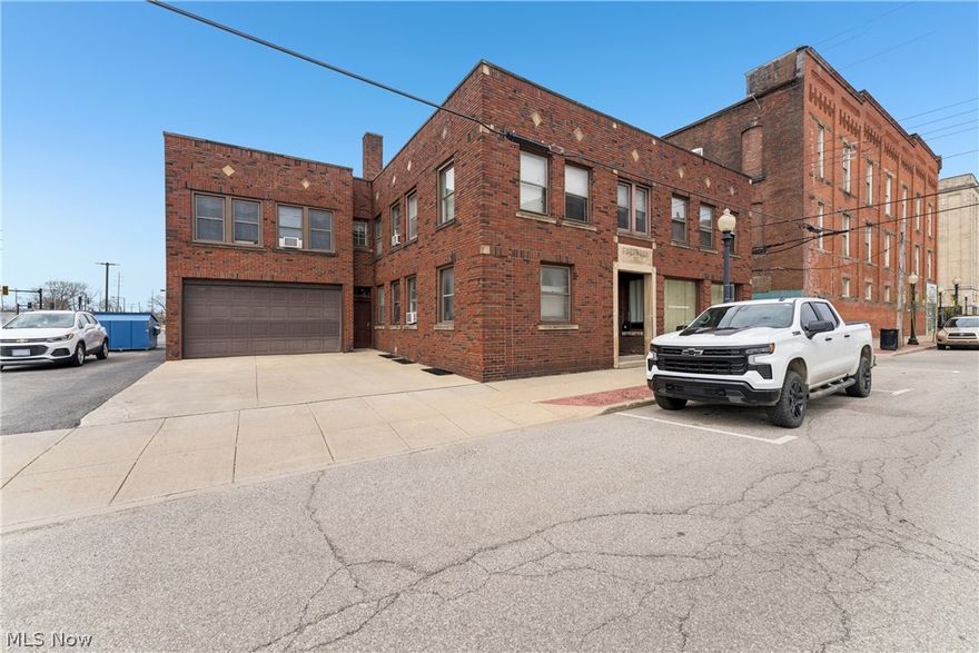 Welcome to the former Barberton Herald Building—an iconic all-brick 2-story investment opportunity in the heart of downtown Barberton, located on the corner of 4th Street and Tuscarawas Ave. Built in 1927, this 7,415 sq ft property offers a unique blend of historic character and income-producing potential. The building features five apartments that currently generate $4,800 per month, nearly $60,000 per year. Also, a 1,200 sq ft retail/commercial space on the main level, complete with three offices, a restroom, and new carpet (2026). The first floor also includes one residential unit, while the second level consists of four additional apartments plus storage rooms. A full basement provides added utility with multiple rooms, a half bath, and a laundry area. Recent mechanical updates include a newer boiler (2022). Additional highlights include a heated 2-car attached garage, a private parking lot with 11 spaces, and ample street parking. Prime downtown location in Barberton, home of the Magics, offers strong visibility and long-term upside for investors or owner-users alike.