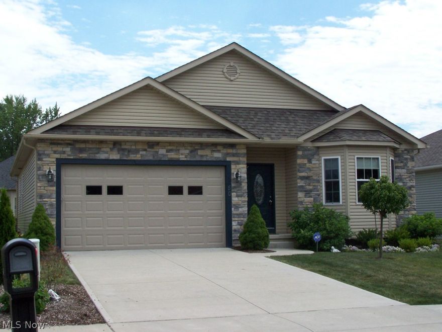 2009 home with open floor plan, corner gas fireplace in the living room.  Sliding glass doors off the living room lead to a spacious deck that is great for entertaining.  Off the deck is a patio for your grill.  The yard is beautifully landscaped.  There are 3 bedrooms on the first floor.  All with ceiling fans and they are carpeted.  Off the hall between the kitchen and the bedrooms is the conveniently located laundry room.  All the appliances are included.  The lower level has a media room for relaxing or entertaining.  There is a wet bar and a second refrigerator.  There's a full bath that is accessible from the media room and the lower level bedroom.  Yes, this is a legal bedroom because it has an egress window for a second exit.  There is another room in the basement besides the furnace room.  This room is great for storage or exercising.  The attached 2 car garage has a garage door opener and plenty of storage.  Call today to view.