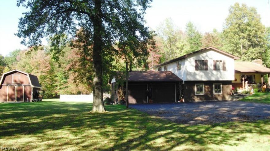 Meticulously maintained inside and out! Outstanding 3 bedroom home nestled on 3.03 acres of beauty! This home has been upgrade with a completely remodeled kitchen, newer carpeting throughout, a newer hot water heater and furnace. Tastefully decorated, this home features a lovely fireplace living room, a formal dining room, a gorgeous sun room, a finished lower level family/media room with a fireplace, an office and three good size bedrooms on second floor. Enjoy the outdoors from a great deck and patio too! There is a barn with a second floor loft plus another outbuilding for storage and the 2 car garage is attached. An exquisitely appointed home perfect for every lifestyle.