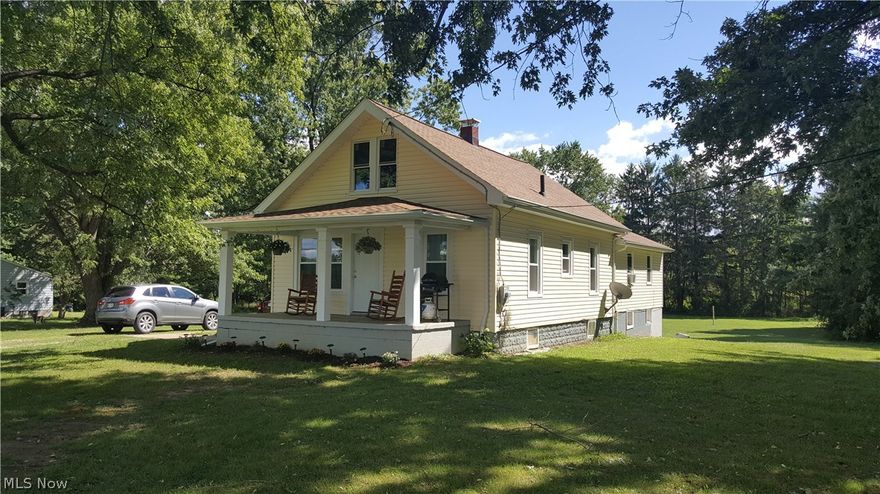 Cozy 2 bedroom ranch with 2 car garage and small outbuilding on 2 acres in Highland School District!   New siding and vinyl windows installed in November of 2015.  Extra large family room with small dining area.   Eat-in kitchen features newer laminate floor. Updated bath.  Walk-up attic for storage.  Updated breaker box and newer hot water heater.   Small shed/barn for extra storage.   2 car basement garage with opener.   Great yard backs up to fields!   Covered side porch overlooks small koi pond.   Oil furnace is currently inoperable, seller will install new propane furnace upon buyer's loan approval, prior to closing.   Sold in AS-IS condition.   Great opportunity to own in Highland Schools with acreage, yet close to shopping in Wadsworth or highway access via St. Rt. 21!