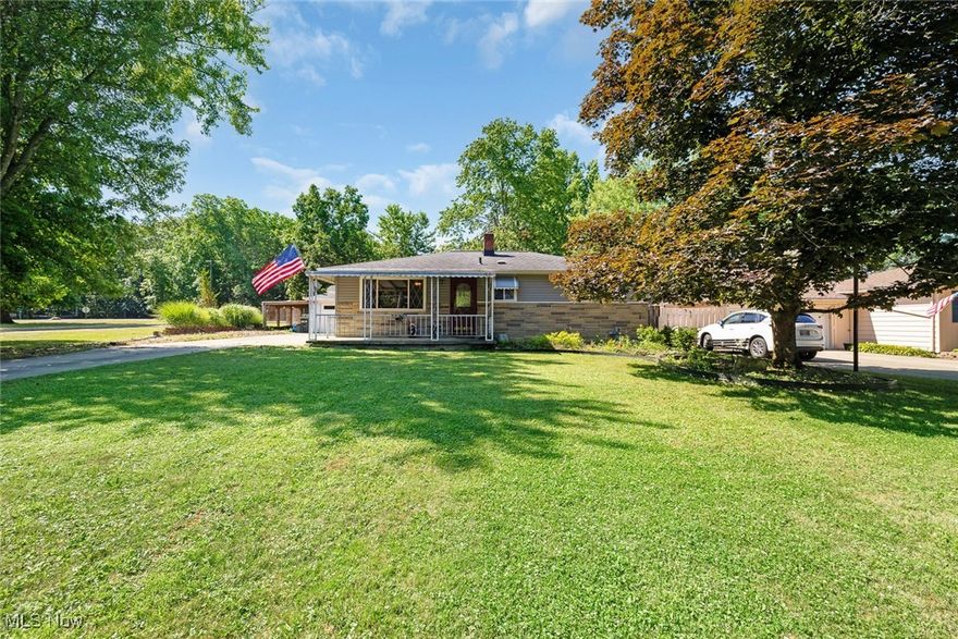 Nice 3 bedroom Ranch with finished basement and amazing back yard * Covered front porch * Living room with hardwood floors * 3 bedrooms with hardwood under the carpet * Updated kitchen with newer cabinets and granite countertops * Finished basement with Rec Room, Kitchenette and Full Bath * Gorgeous fully fenced private back yard with fire pit area and deck * Oversized 2 car garage with storage room in back and workbench * Add'l carport * Shed * Vinyl replacement windows * Roof 2015 * Furnace and C/A 2018 * Glass block windows * All appliances stay * Must see today!