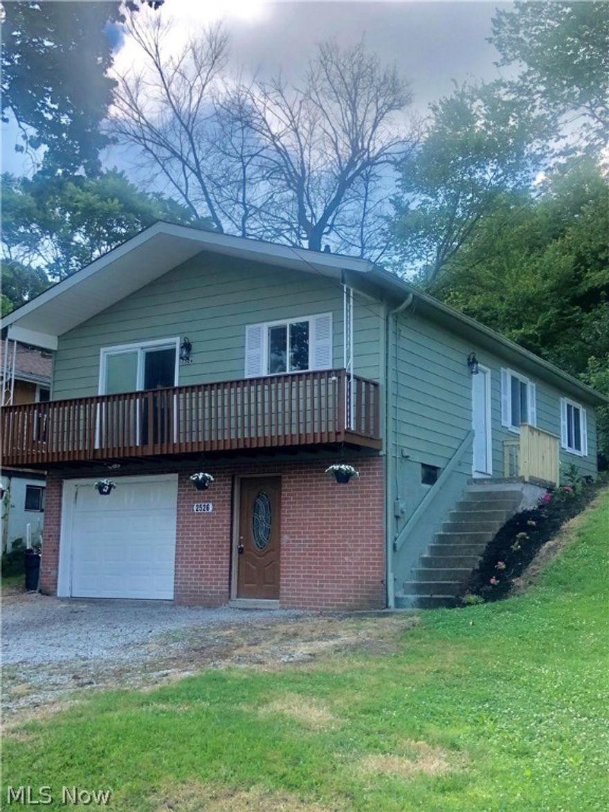 Here it is!!  The weekend lake house or year round nest.  A short walk from the dock and playground at Springfield Lake in the quaint Village of Lakemore.  This nicely updated ranch sits on its perch with beautiful sunset views from the outside deck.  The main floor features fully renovated kitchen with all new cabinets and appliances, butcher block counters, new flooring, 3 Bedrooms and updated bathroom and don't miss the newer windows and new light fixtures throughout.  The lower level (not included in square footage) was also updated adding additional useable space with inside access.  From the outside you can enter directly into the lower level entrance to find the perfect mud room with fresh paint and plenty of space to keep your bikes, fishing gear, kayaks and toys.  Behind this is a separate bonus space, a large rec room great for a kids' playroom, man cave, crafting corner or whatever your special need or desire may be.  The left side offers the single car garage, separate laun