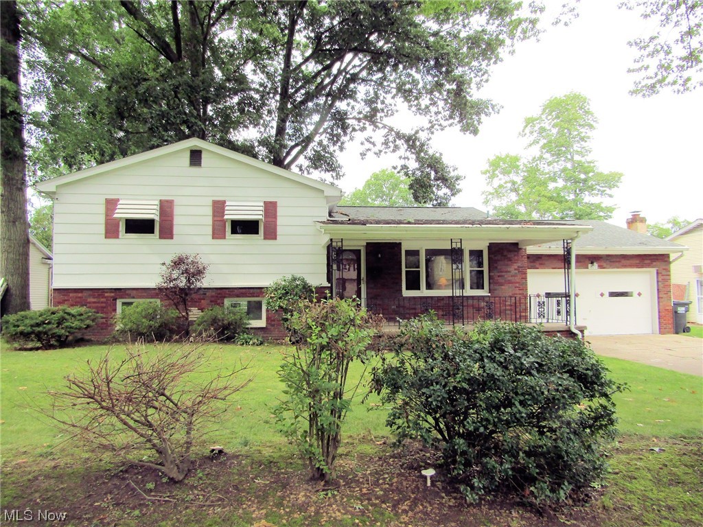Four level split, main level living room and ear in kitchen with newer countertops. Second level 3 bed. With hardwood under carpet,2 1/2 bath, one recently remodeled. Lower level, great room and half bath. 4th level is basement. 2 car garage, shed.