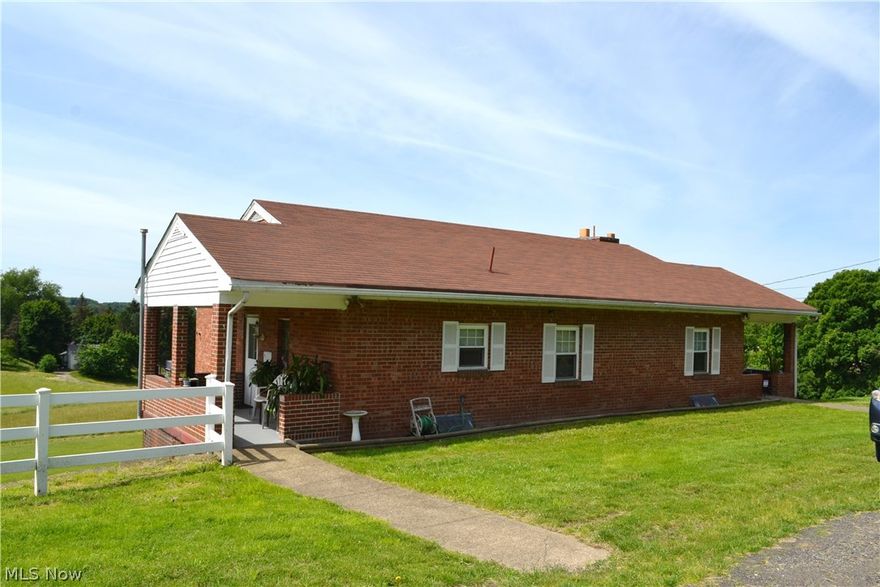 COMFORTABLE COUNTRY!  Easy one level living in this 2 Bedroom brick ranch in New Cumberland situated on 1 acre of ground.   Updates include newer kitchen, bath, flooring, plumbing and electric.  Offers a comfortable living room, spacious kitchen with dining area, central air and 1 car garage.