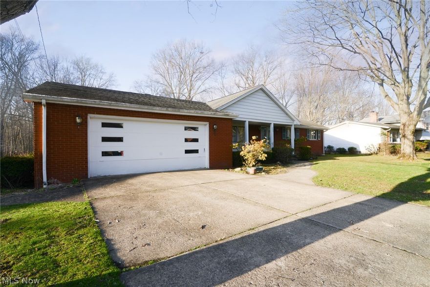 Here's your chance for a brick ranch that overlooks Mill Creek Park.  Spacious ranch with a door separating the bedrooms and 2 full baths from the living area.  Large well equipped kitchen.  Appliances stay.  Amazing basement area with a full kitchen, bedroom, full bath and rec room area.  Enclosed porch and concrete patio overlooking the park.  Oversized 2 car garage with drain, H/C water & extra storage.