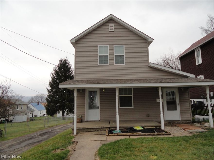 Recently updated 2 BR home on a corner lot features LR w/laminate fl & built in bookcases, Formal DR w/laminate fl & built in china cabinet, updated fully equipped kitchen w/laminate fl, hickory cabinets, abundant counter space, ceramic backsplash & brkfst bar, separate mud rm entry w/ceramic tile, updated bathroom, back yard deck & detached garage.  Newer vinyl siding, updated vinyl windows, roof, heat & C/A -5 yrs. Updated 200 amp panel.