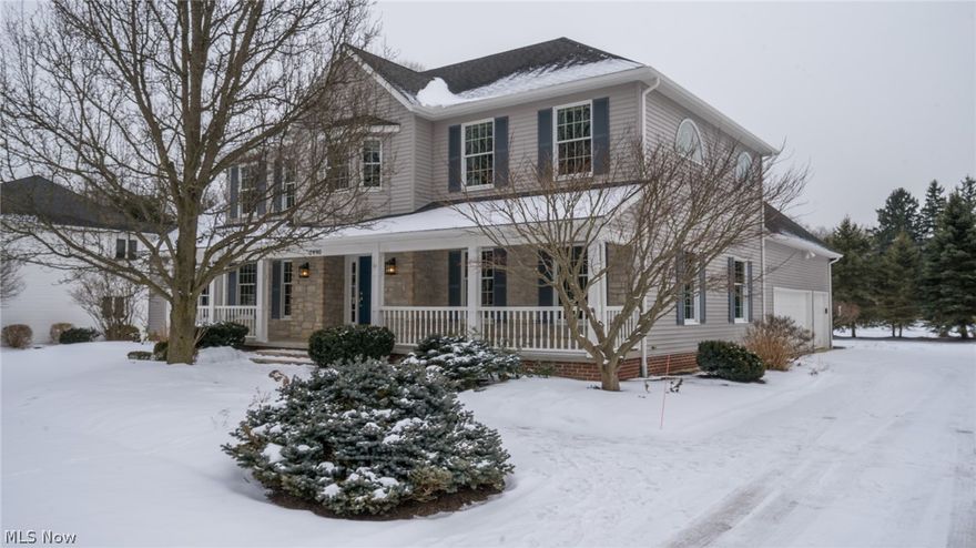 Located in Emerald Woods, just a stone's throw from Cuyahoga Valley National Park.  As you pull up, it is immediately inviting with its sweeping front porch, stone facade and impeccably landscaped yard. 4 bedroom 3.5 BA colonial just painted on the main floors. Upon entering, you'll instantly feel the simple sophistication, and charm of a New England style home.  Beautifully stained hardwood floors adorn the foyer, dining and kitchen. Relax and watch your favorite TV show or movie with warm drink by the gas fireplace with vaulted family room ceiling. Sit a spell in any room and enjoy the natural light or during the spring and summer months open the slider doors by the kitchen eating area and step outside with a cold beverage and enjoy yourself on the stone patio. The kitchen has a large granite island with granite counters and new stainless steel appliances. First floor laundry and updated 1/2 bath and office/den are just off of the kitchen. Sizable bedrooms with new carpet by a common