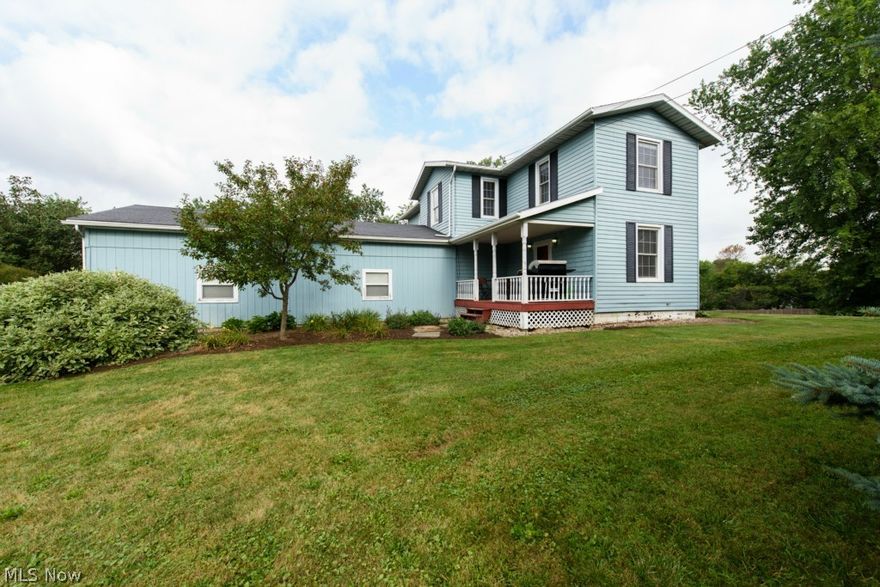 Room to roam in this large 2 story home situated on a 1.75 acre corner lot!  This home has been nicely updated with neutral décor throughout and the 9.5' ceilings on the main make it feel even more spacious.  You will love the bright kitchen with tons of natural light that includes cherry stained maple cabinetry, a breakfast bar, 18" ceramic tile flooring and wainscoting for additional charm.  The owners have removed a wall to open the kitchen to the formal dining room and have added wood laminate flooring that leads to the living room with built in corner cabinet and access to the front porch.  There is also a den on the main level that is currently being used as an office plus a full bathroom with corner shower and tile flooring.  Upstairs you will find a master bedroom that has lots of storage with double closets and a walk in and two more good sized bedrooms. All share the recently updated full bath with two vanities, new bath tub, linen closet and laminate flooring.  A laundry roo