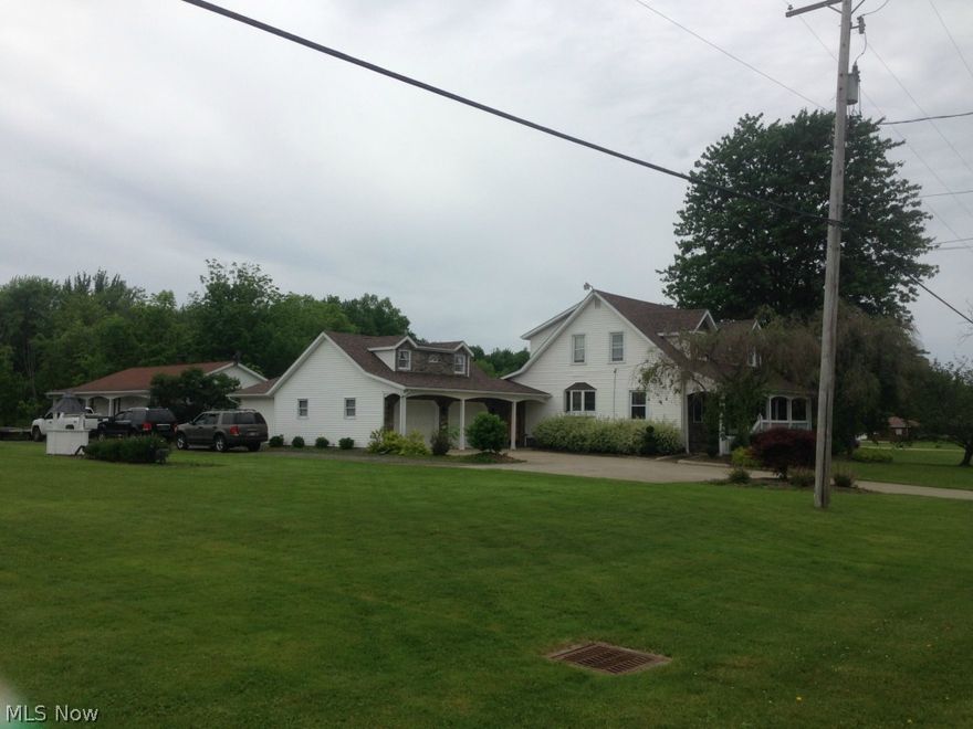 WOW!!! What a great property just outside of town on 2 rolling acres with creek running thru the property!!! Walk into huge living room then proceed into dining room that opens up into open kitchen with new flooring and then proceed down staircase to family room with wood burner, new carpet  and sliding doors leading to deck overlooking 2 acres. First floor bedroom and full bath and huge master bedroom and bath upstairs with tons of closet space and glamour bath with new stone surrounding it  and 3 bedroom upstairs. Attached 2 car garage with extra space on back for lawn mower and all your extras. New roof, water system, hot water tank and stone on front of the house....Huge outbuilding with wood burner , kitchen and full bath great for hang out area or extra income for rental....what a perfect property just outside Jefferson Village!!!!