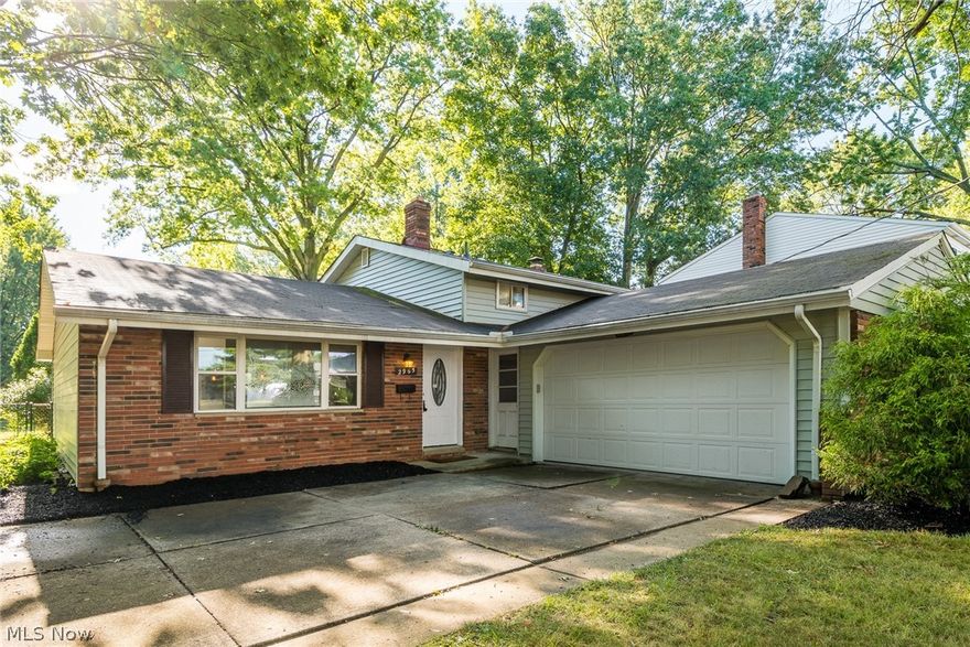 Move right into this spacious split-level home with vaulted ceiling, open-concept floor plan and surrounded by mature trees.  This desirable home is freshly updated throughout in 2020.  Renovations include all new kitchen with stainless appliances, beautiful cabinets, counters and flooring; upstairs bath with new double sinks, vanity, toilet and bath/shower; family room with new flooring, recessed lighting and access to huge laundry room with updated full bath, shower, toilet and vanity.  Ceiling fans add comfort and style to vaulted living-dining area and all three bedrooms up which also have original hardwood floors.  Additional features include fenced yard, attached oversized two-car garage, French doors with access to the rear patio and lots of storage.  Visit today!