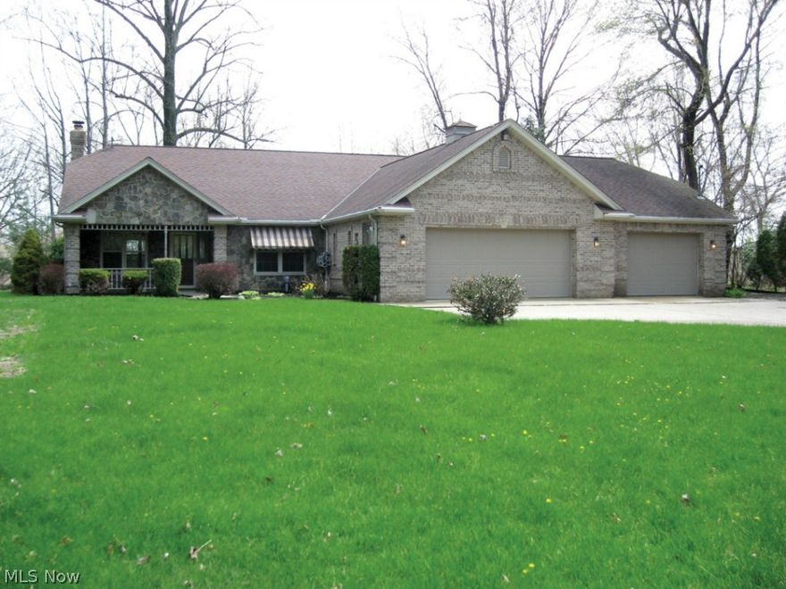 Contractor's custom built brick ranch on quiet, secluded lot.  Impressive brick and stone work inside and out.  Great room features vaulted ceiling, fireplace set in a whole wall of Tennessee Field Stone along with an extra 12 x 12 flu liner for wood stove.  The open floor plan features a gourmet kitchen complimented by custom curly cherry cabinetry.  Kitchen island opens to great room.  Solid cherry wood trim throughout.  The huge four car heated garage for the weekend mechanic or car lover features loads of storage and a new vinyl epoxy floor.  Heated sun/Florida room and front and back porches.  Well insulated.  Includes double insulated ceilings, New Heil heat pump.  New refrigerator. Master bath has both a Jacuzzi tub and a free-standing shower.  Loads of storage.  Handicap accessible throughout.  Close to I-90.  Must see to appreciate.