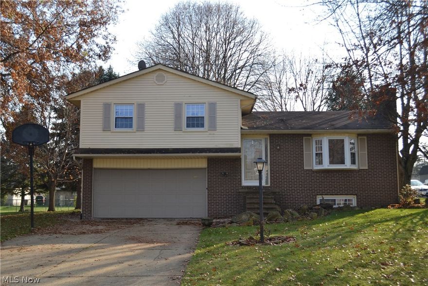 Nicely Updated Three Bedroom Split Level Home on Quiet Cul-de-Sac.  On the Main Level there is a Large Living Room, Dining Area and Kitchen with Counter Seating/Island.  Access to the Back Deck and Yard from the Dining Area Sliding Glass Doors.  Three Bedrooms and a Full Bath on Second Floor.  The Master Bedroom Has a Huge Walk-In Closet!  The Family Room/Media Room is on the Lower Level - Includes a Brick Wall with Fireplace, and Newly Installed Ceramic Tile Floors.  Another Full Bathroom with Shower and Pedestal Sink on Lower Level.  Garage is Oversized - With Room for Work Tables and Additional Shelving.  Shed.  Concrete Driveway.  Nice Flat Back Yard - Great for Entertaining or Playsets.  Possession at Closing!