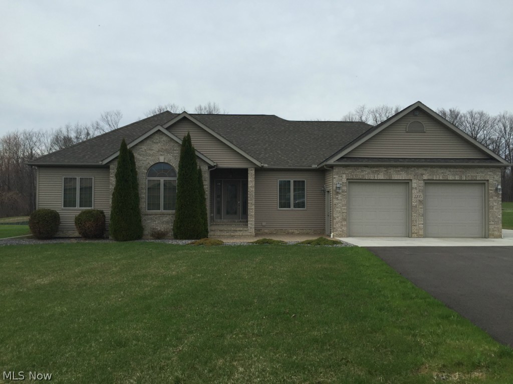 Not just an ordinary 1920 sq ft home, but comfortable, quiet, luxury beauty with all of the amenities. Outside the 150 plus ft of paved wide drive leads to the 860 sq ft. - attached 3 dr garage. (door openers on 2 front) The garage features " in floor" hot water heating and work area. The 3/4 acre, 22 foot depth pond is the water source with entertaining hand fed fish. In back of the house is a 32' x 40' garage outbuilding w/the 10 ft automatic dr, man dr, and concrete flr. The inviting wide entry foyer features laminate wood style flooring with the beautiful twin glass lite and a frosted glass door. The foyer is the entry to the giant 17 x 21 great room with the elegant propane gas fire place, long Cradco casement windows allowing lots of natural light. Lots of oak kitchen cabinets and a pantry closet with the laminate wood style flooring. The large comfortable Master Bedroom features the walk-in closet, recessed lighting hidden in the oak crown molding, a double sink m
