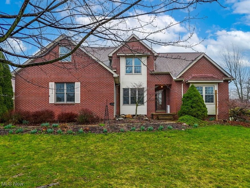 Welcome to this impressive 5 Bedroom, 3.5 Bath dream home in beautiful Wadsworth! Situated on over 2 acres, enjoy outdoor living and entertainment in the charming Sunroom surrounded by sliding doors opening to the wrap-around composite deck overlooking the backyard oasis featuring an Inground heated Pool and garden with a small potting shed. Step inside to discover the Open Floor plan redesigned in 2017 for a seamless flow between the Great Room with soaring vaulted ceilings accentuating the  floor to ceiling brick fireplace flanked with a wall of windows and the spacious renovated Gourmet eat-in kitchen with Granite countertops, plentiful custom Cherry Cabinetry with soft close drawers, and a convenient breakfast bar. The first-floor Master suite features Hardwood floors, a cozy window seat, and dual closets. Pamper yourself in the Master bathroom complete with a corner garden Jetted tub, walk-in shower, dual sink vanity, and a walk-in closet. A formal dining room (currently used as a media room) rounds out the first floor. Head upstairs to four bedrooms, including one bedroom with an en-suite bath. The remaining bedrooms share access to another full bath. The 2nd floor also includes a Bonus room that could be used as a sixth bedroom, office or studio - your choice! In addition to the attached 2-car garage, the hobbyist will appreciate the large outbuilding capable of housing 4 cars or even a boat! Additional highlights include a Partially Finished Basement with a Rec room and abundant storage throughout, a First-floor laundry/mudroom, and a 1-year Home Warranty for the Buyer's peace of mind (Pool coverage included). Plus, enjoy the convenience of a newer H2O heater (1 y/o), tear-off roof and HVAC (both ~10 years). Located in the highly-rated Wadsworth City School District and with easy access to I-76 and I-71, this home also offers proximity to River Styx Park and Ridge Top Golf Course. Don't miss the opportunity to make this your forever home!