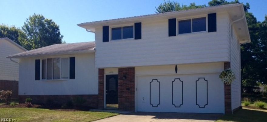 This completely renovated 3 bedroom, 1.5 bath split with basement and 2-car attached garage is situated on a 75' X 170' lot on a very quiet street in southern Parma. There is fresh paint, new flooring, plumbing and light fixtures throughout. Kitchen has all new Whirlpool stainless steel appliances, granite counter tops, glass backsplash, matching breakfast bar, and wood-grain vinyl plank flooring. Full bath has new flooring, tub and surround, vanity top, and light fixture. Living room, dining room and family room have new carpet and light fixtures. Bedrooms have refinished hardwood floors and new LED light fixtures. Washer, dryer, and 2nd refrigerator are included. There is a new electrical panel, newer HVAC and hot water tank. Exterior has new landscaping and concrete patio. A home warranty is included.