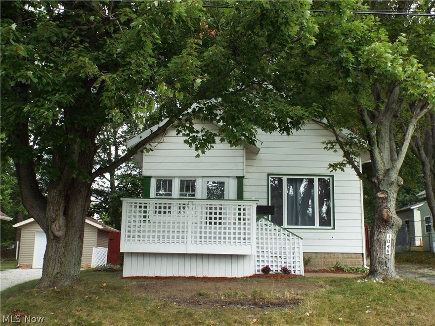 Great starter home. Charming Bungalow with hardwood floors on main floor. Deck, enclosed front & back porch and patio area. Fenced in yard, backs up to the city park. Upstairs attic can be used as a third bedroom & 1/2 bath as it has gravity fed heat. Kitchen has been updated with oak cabinets but needs your finishing touches. Home has been freshly painted. A new roof in 2016 on main part of house, new electric service 2017 and new furnace 2017. One car detached garage along with a 8x10 storage shed. Home Warranty Included. Great neighbors, great location!Home is being sold as is, seller to make no repairs.