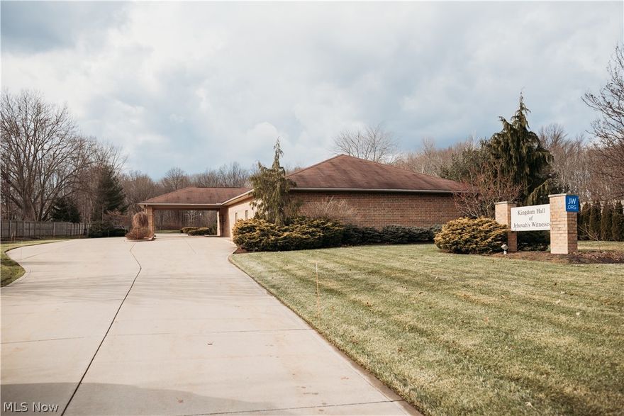 This all brick building was formerly used as a place of worship. The building and mechanical systems have been very well maintained. Enter into a spacious, welcoming reception area with cabinets, display area and coat room. The large, light-filled auditorium has windows for natural light and seating for over 150. There are 2 additional meeting rooms, one with a kitchenette and conference table, other with additional seating of 20+ and book shelves. Men's and women's restroom and additional single wheelchair accessible restroom. Maintenance/utility sink room with storage. Plenty of parking with lighting for additional safety and security. Beautiful wooded view in back. So many possibilities!