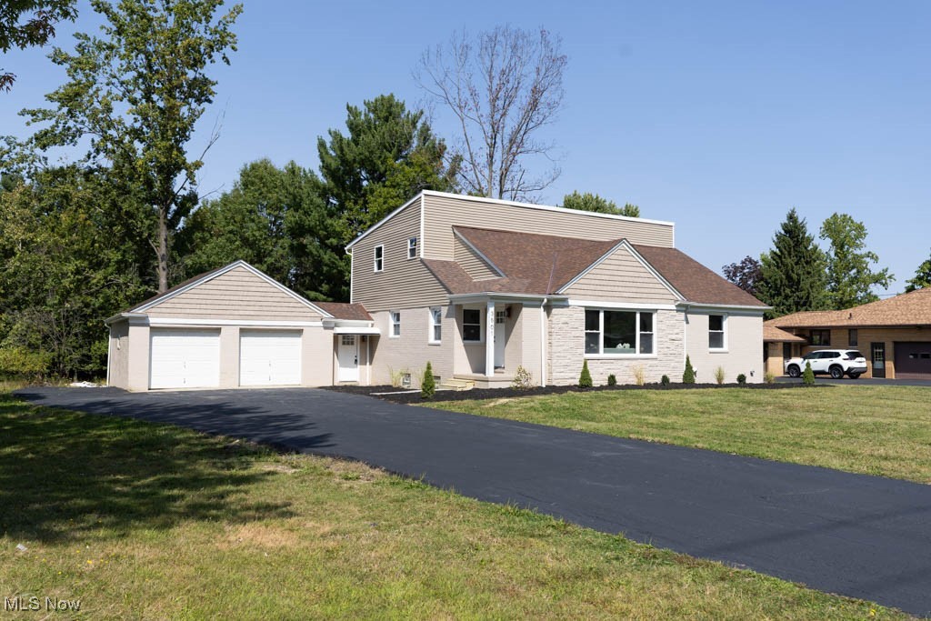 Welcome to 3501 Oakes Rd. in the desirable community of Brecksville with award winning schools and sits on nearly 1.5 acres right across the street from the brand new elementary school and Boston Hill sports complex. This executive style rental near highways, downtown Cleveland and Akron has 4 bedrooms 3 full bathroom home is as close to new construction that a fully remodeled home can be. This home includes brand new; roof, resurfaced driveway, energy star windows, siding, energy star certified high efficiency insulation, furnace, AC, hot water tank, plumbing, drywall, fixtures, new gas line to the house, new electrical panel and service as well as brand new wiring throughout. Head in through the front door and you'll notice the open concept and bright open space throughout. The light oak LVP floors are a breeze to take care of. There is a large bay window that allows plenty of natural light in and can lighting as well as ceiling fans in most rooms for plenty of light. The kitchen features a large island, maple shaker style cabinets with tiled backsplash and stainless steel appliances. There is 1st floor laundry, large mudroom entry way from the garage and 2 large bedrooms with a full bathroom. This leads to the 2nd floor where a new addition was built to accommodate for more square footage and modern amenities. There is a large guest bedroom with walk-in closet and on suite bathroom. The owner's suite has french doors that leads to a massive bedroom with large walk-in closet and bathroom that has 2 vanities and large tiled shower. The basement has plenty of storage room, 1/2 bath roughed in and walks out to the back yard.