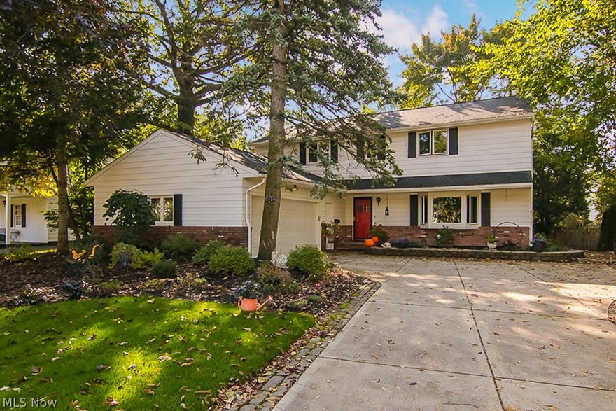 Naturally elegant and lovingly cared for, this gorgeously updated 3,000 sqft+ colonial in Shaker Heights has it all! You are greeted by a beautifully landscaped exterior, and will immediately feel at home as you step into the light and bright tiled foyer. Entertain with ease in the spacious living and dining rooms, complete with gleaming hardwood floors, newer bay window, and neutral paint colors. Step into the gourmet eat-in kitchen which showcases new vinyl plank flooring, large center island, tile backsplash, stainless steel appliances (refrigerator 2017) including double ovens, and an abundance of cabinet space. Spend lazy Saturday mornings in the cozy family room, complete with brick fireplace, built in shelving, and wet bar with newer cabinets. First floor also offers large powder room, and spacious laundry room. Second floor offers 4 spacious bedrooms with hardwood floors, including large master suite complete with walk in closet, ensuite full bath with oversized walk-in shower