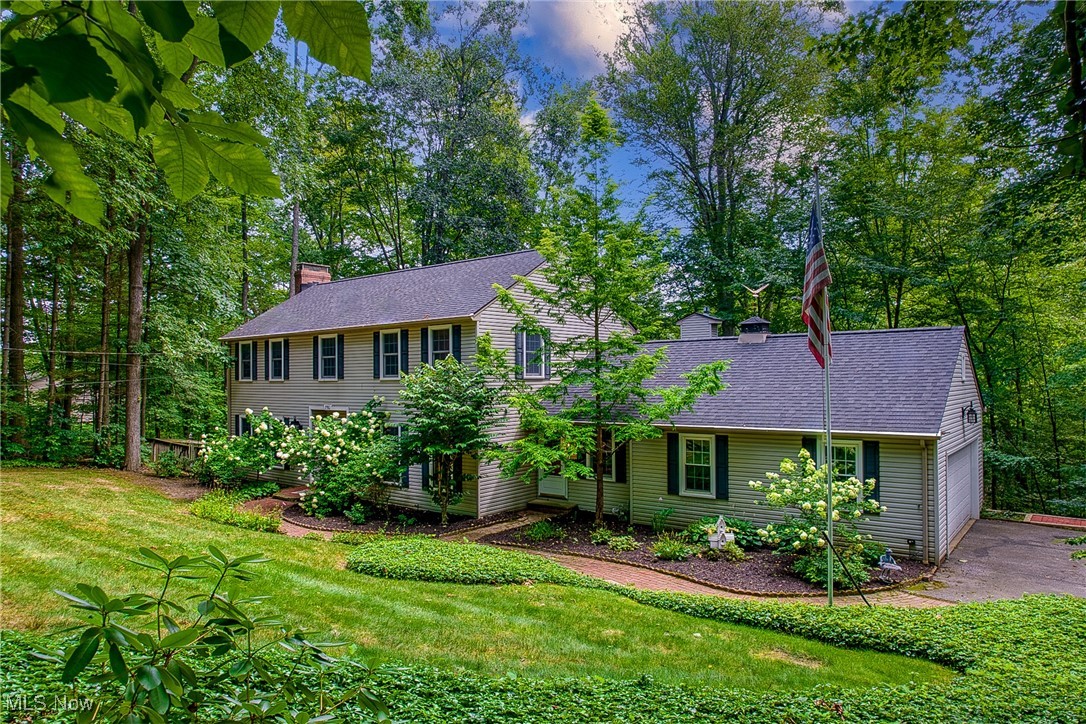 Welcome to this stunning Colonial in the desirable Yellow Creek Woods of Bath Township, perfectly nestled in the woods on a quiet cul-de-sac. This beautifully updated home offers a warm blend of charm, modern upgrades, and breathtaking nature views.
Step into the open foyer where you’ll find a formal living room to the left, complete with built-in bookcases, cozy fireplace, and double doors leading to the back deck. To the right, the dining room is a design lover’s dream with vibrant wallpaper and a statement light fixture.
The back of the home showcases an expansive open-concept great room featuring a brand-new remodeled kitchen (2025) with stainless steel appliances, side-by-side refrigerator, induction range, built-in microwave, and an oversized island seating nine. The kitchen flows seamlessly into the family room with a beamed vaulted ceiling, fireplace, and two sets of double doors opening to a wrap-around deck with serene wooded views. There is also a butler's pantry off the kitchen and a room that would make a perfect home office, which could also be converted to a first floor laundry.
Upstairs, you’ll find four bedrooms, including a primary suite with his-and-hers closets and an updated bathroom with a walk-in shower. One bedroom has been transformed into a luxury California Closet but can easily be converted back. New carpeting throughout the second floor adds comfort and style.
The finished walkout basement offers additional living space with patio access, perfect for a recreation area or in-law suite. There is a fenced side yard, roof replaced in 2022, and Davis-serviced water softener system complete this exceptional property.
Experience the privacy, luxury, and beauty this Bath Township home has to offer!