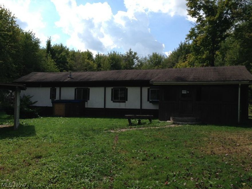 Looking for something out of the way but yet close to town?  Take a look at this get-away house on 3 acres in Andover.  It's not your typical mobile/manufactured home because of the additions.  It does needs some work, but well worth the effort.