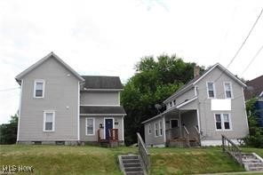 Don't miss this amazing opportunity to own this 3 unit rental property located near the University of Akron. This property consists of 1 two unit and 1 single family house on one parcel, plus an additional parcel for parking. Addresses include 590 Sumner and 596 Sumner. Owner pays utilities with a utility cap. Recent improvements include a new hot water tank 2024, new paint 2020, new flooring 2019, new surround tub 2021. The single family unit is rented, but the other 2 unit is vacant. The list price is below the appraised value. Please call to schedule a showing.