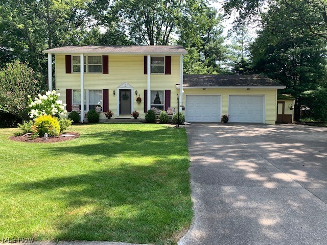Here you go! Now is your chance to get a 4 bedroom home on a cul-de-sac in Stow! Most of the home has hardwood floors under the carpet. The furnace, AC and hot water tank are between 2-3 years young. The fridge is about 3 years old. About half of the windows have been replaced. This lovely home is painted in neutral tasteful colors and it also features a fabulous and spacious deck off the living/dinette area, with stairs down to a wooded semi private back yard. There is still plenty of yard for firepits and play areas! The driveway has an additional third parking lane. This home also has a shed, but it will need some TLC as some of the wood has some damage and could use some siding over it. The 2 car garage also has 2 new doors and new garage door opener! The basement is partially finished and has a door to walk out to the back yard.