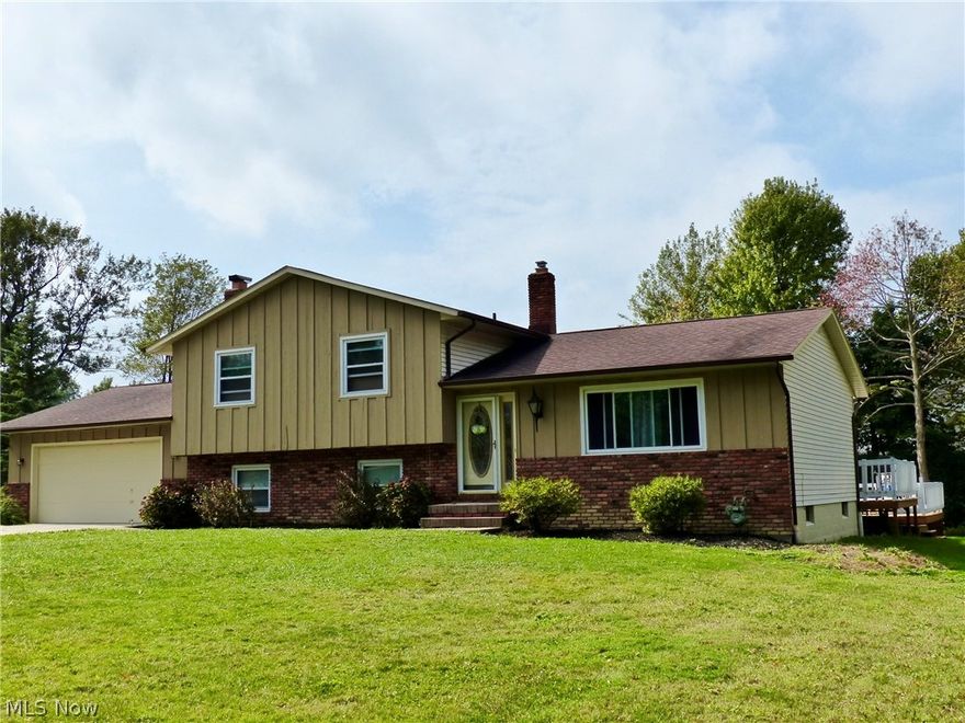 Located in South Mentor off of Route 84 this 4 level split offers a lot of living space. Lead glass front door into the living room, formal dining opens to white kitchen with all appliances plus island with breakfast bar, sliding doors to deck, LL rough sawn cedar L-shaped family room with brick fireplace and brick wet bar and sliding door access to patio, spacious full bath convenient to daily living,  basement level offers carpeted rec room and laundry room with wash tub.  Three bedrooms upstairs, all with fans plus a full bath with ceramic flooring.  The home offers natural light and a large yard with above ground pool (1 year old), 2 tier deck is an entertaining size of 42 x 25, storage shed, 2 car att.garage, ceiling fans through out, fresh paint and 12 month home warranty