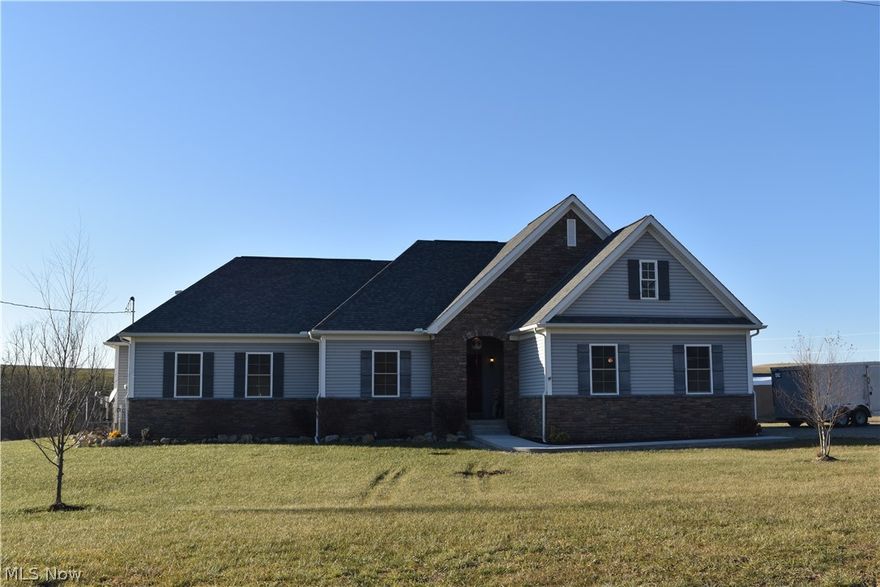 This stunning custom built ranch home is situated on 7 acres with beautiful country views. Lovely open floor plan with cathedral ceilings and recessed lighting. Gorgeous kitchen with some newer cabinetry and it has an island. There are 3 bedrooms and 2 full baths, one being a beautiful Master suite with his and her closets plus separate his and her bathroom sinks. Large unfinished basement full of possibilities. Nice 2 car attached garage along with 2 - 1 car detached garages. One of the detached garages is heated and has a workshop plus a covered patio off of it. Enjoy time on the patio while watching over your animals in the large fenced area.