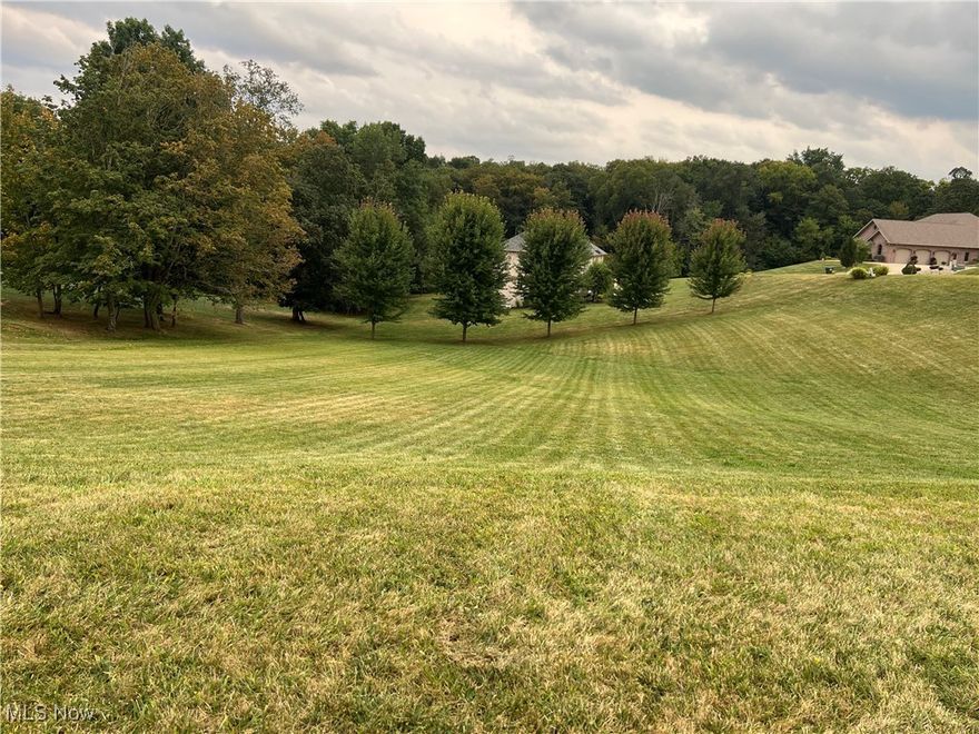 Set within an intimate, wooded neighborhood of distinguished custom homes, this premier lot offers the perfect canvas for your vision. Just minutes from Belmont Hills Country Club and I-70, the location combines refined convenience with the serenity of a natural backdrop.

The community is gracefully designed with only two quiet streets, preserving both privacy and exclusivity. Underground utilities—including gas, electric, cable, sewer, and water—are readily available, ensuring a seamless building process.

Here, natural beauty and architectural sophistication come together, creating an idyllic setting for a residence of timeless elegance.