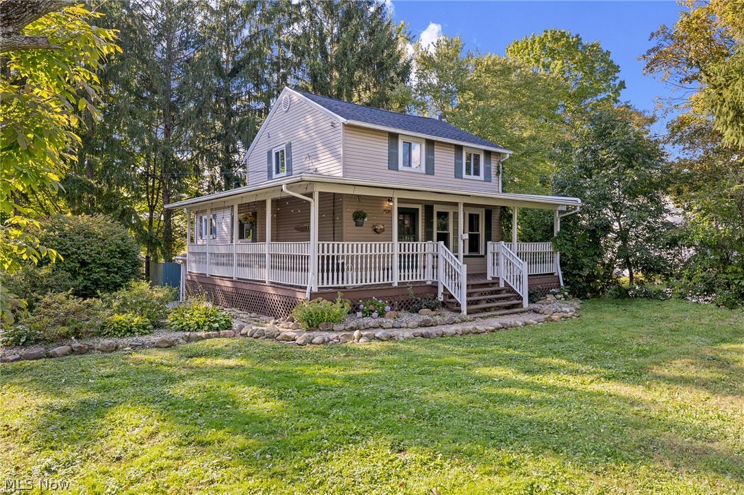 Beautifully updated 3BD/2BA farm-style colonial with charming wrap-around porch on large corner lot! Fantastic location directly across the street from Stanton Middle and Roosevelt High schools and minutes from the Portage Hike and Bike Trail and downtown Kent. Nearly every inch of the home has been transformed into a welcoming and modern farmhouse style. Enjoy the maintenance free luxury vinyl plank flooring (2020) throughout the main floor and all bedrooms. A clever shiplap dividing wall creates a functional separation between the entry and the living room that opens to the large eat-in kitchen with faux brick wall (2019) and sliding barn doors (2020). A couple steps up from the kitchen is the cozy family room that features a delightful electric fireplace (2020) that has been framed beautifully with shiplap paneling and provides the perfect space to entertain or to curl up with a book. A convenient 1st floor bedroom and updated full bath (2019) with shower rounds out the main level.