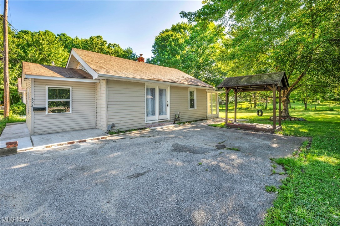 Welcome to your cozy retreat in charming Brady Lake! This recently remodeled home, situated on a peaceful dead-end street, offers a perfect blend of comfort and simplicity. With new flooring, fresh paint, and an updated bathroom, it's ready for you to move right in. Featuring convenient one-level living, this home includes two inviting bedrooms, a bath, and laundry facilities all on the main floor, ensuring easy accessibility without any stairs. The kitchen comes equipped with included appliances, making it perfect for everyday meals. The bathroom boasts a nice walk-in shower and a modern vanity, adding a touch of style. Enjoy your morning coffee in the sunroom that overlooks the yard, where you can unwind and relax. The outdoors is complete with a shed, a lovely pavilion, and a fire ring, perfect for entertaining or enjoying quiet evenings. Plus, there's room to park two cars on the paved driveway, making it a practical choice. This clean and charming home is located just a short distance from Beckwith Apple Orchard and next to The Portage Hike & Bike Trail, offering you plenty of recreational options right by your home. Don't miss out on this opportunity for a sweet and comfortable living space. Call your second favorite realtor today to schedule your showing!