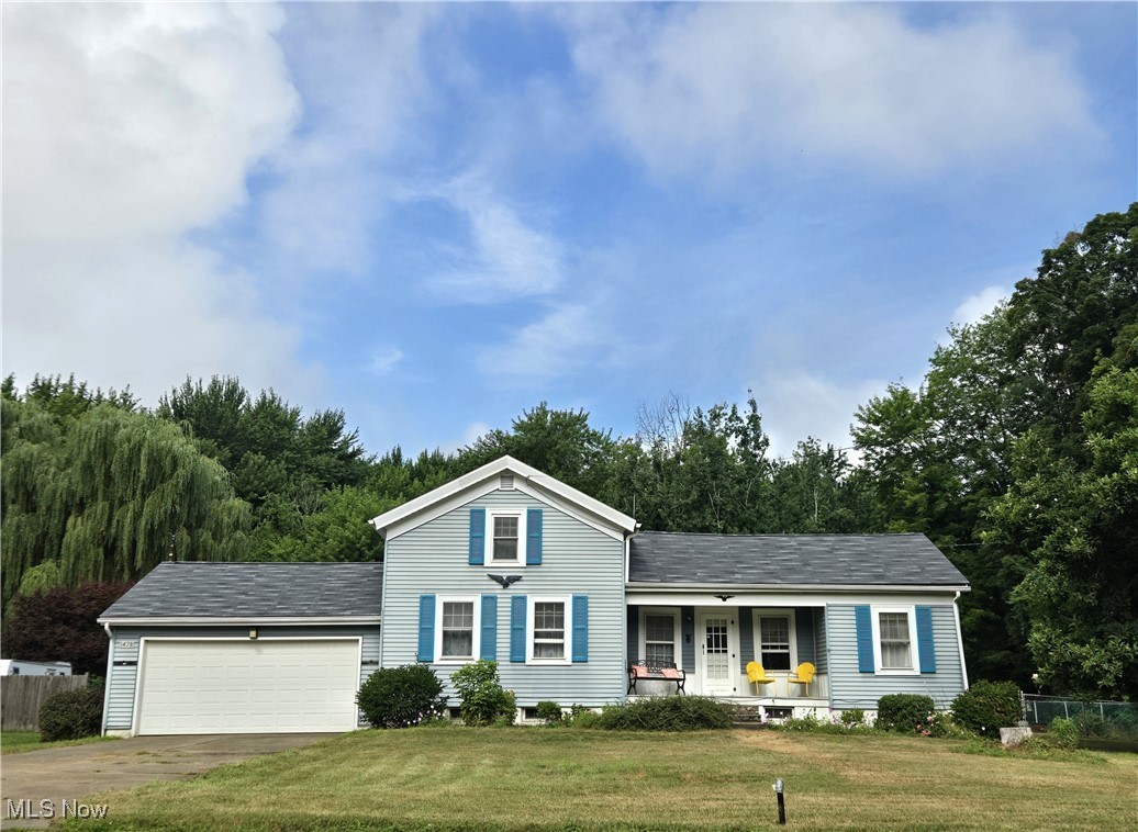 This unique home sitting on a spacious lot has plenty to offer! With main floor convenience, this home has two bedrooms on the first floor and one on the second, as well as a first floor laundry. The family room has a cozy, chalet vibe with a vaulted, beamed ceiling, wood-burning fireplace, and small loft. Outside, sit on the covered front porch with friendly neighborhood views, or out back on one of two patios (one covered and one open) to bird watch and enjoy newly planted trees. The fully fenced-in back yard is perfect for gardening, family, and/or pets! 2025 updates include a new roof, remodeled bathroom, and upgraded electrical! Minutes to shopping, restaurants, golf, and Madison Township Park/Lake Erie. One-year home warranty included!