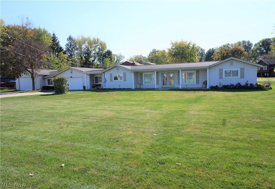 Amazingly spacious ranch in great condition! Big rooms. Open layout. Two full baths. This kitchen is made for dancing! Large kitchen! So many cabinets and counter space. First floor laundry. Long concrete drive with turn around. Garage space for 4 cars, plus. Two garages. One garage is heated. BIG lot!
Large living room is open to the formal dining room. Walk through French doors into the beautiful, bright, light family room with a custom oak gas fireplace and built in cabinet wall. Lots of windows! walk out onto a deck. PLUS a heated sunroom that has another smaller deck out to backyard. PLUS a bonus space that is currently an exercise room. This property goes on and on. Must see.