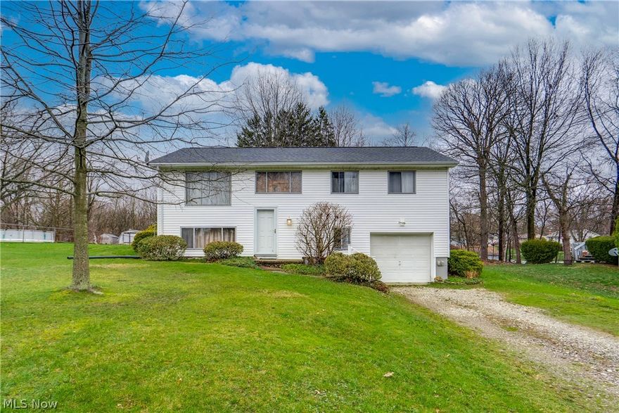 Here is your chance to own this wonderful bi-level home in Melody Village. Located in the Norton CSD, the home offers 1,525 total square feet including 3 bedrooms and 1 bath on a gorgeous .46 acre homesite. Inside, find a cozy kitchen with all appliances to remain. The dinette space is open to the front living room and also has access to a patio and deck. A great option as you consider your living style is to utilize the hardwood flooring that runs through the main floor. In addition to the three bedrooms on the main level, you will find an updated full bath including a vanity with a granite top. The lower level has a large family room with a bar area, storage space, and a laundry area. Typical of a bi-level home, the garage is also accessed from the ground level. The 1-car garage has extra space similar to having a built-in shed without having to go outside. Just under a half acre, the lot is beautiful and the location could not be better!