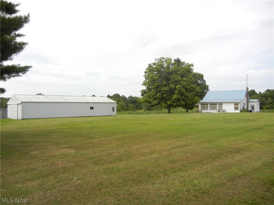 Come take a look at this 3 bedroom home in the country on 1.857 acres! High setting and level ground. This 1920 home has vinyl siding, gas heat, central air, updated electric, and a new metal roof. 1644 square feet of living space plus unfinished basement. Large eat-in kitchen, living room, family room, bath, and entryway. 2 bedrooms on main floor with 2 rooms upstairs. Lots of built-in cabinets. There is a 28x70 pole building with concrete floor, electric, and new overhead doors. Also a 624 sq. ft. shop building with lower level. Plenty of room for some pasture.