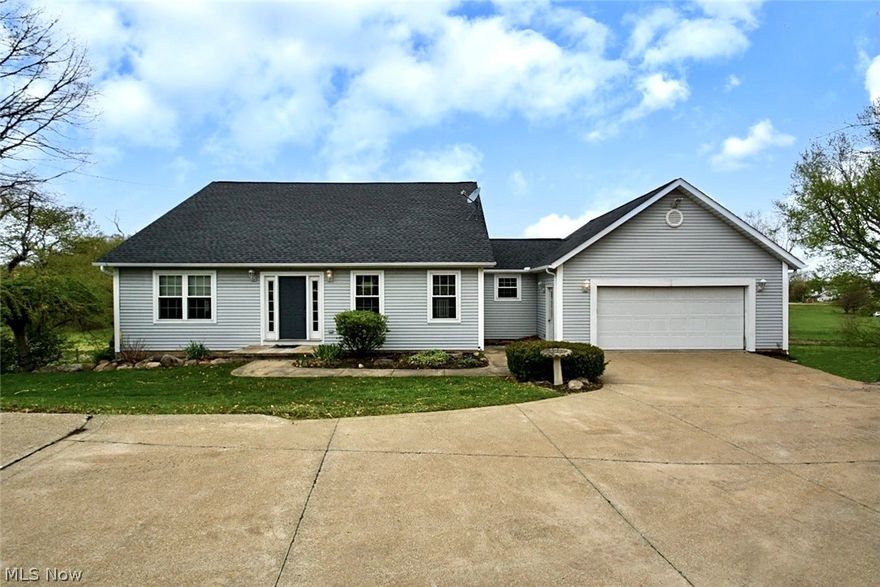 Country living with city conveniences for this spacious 4 bedroom, 2 full, 2 half bathroom cape cod style home on more than a 1.5 acre scenic lot! Open floor plan offers vaulted ceiling and bamboo floors in the great room. Dining room with ceremic tile floor and access to the vinyl deck through a sliding glass door. The kitchen has an island with a beakfast bar, and plenty of maple cabinets. A first floor master suite offers a vaulted ceiling a full bathroom with a jetted tub, and access to the deck. The first floor laundry/ mud room and a half bathroom complete the main floor.  2 bedrooms and a full bathroom on the second floor. A finished walk-out L.L with a 4th bedroom and another half bathroom, and a fireplaced family with a sliding glass door to the patio and beautiful views. Roof and C/A about 5 yrs old, windows 3 yrs old, furnace less than a year old