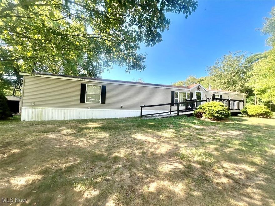 Discover country living with quick access to the city in this 1996 home, nestled on 2.02 acres. Enjoy the peaceful surroundings while still having quick access to the amenities. This property previously accommodated two mobile homes, offering the potential for expansion or additional space for those seeking more.  Inside, you'll find newer flooring throughout and a spacious primary bedroom featuring a large en suite bathroom for added comfort and privacy. Appliances can convey with the sale, making this home move-in ready. Priced affordably at $78,877, this property is an excellent opportunity for first-time homebuyers or those looking for single-level living. With plenty of room to build your dream home in the future, this property offers both comfort and flexibility. Call today for more information!