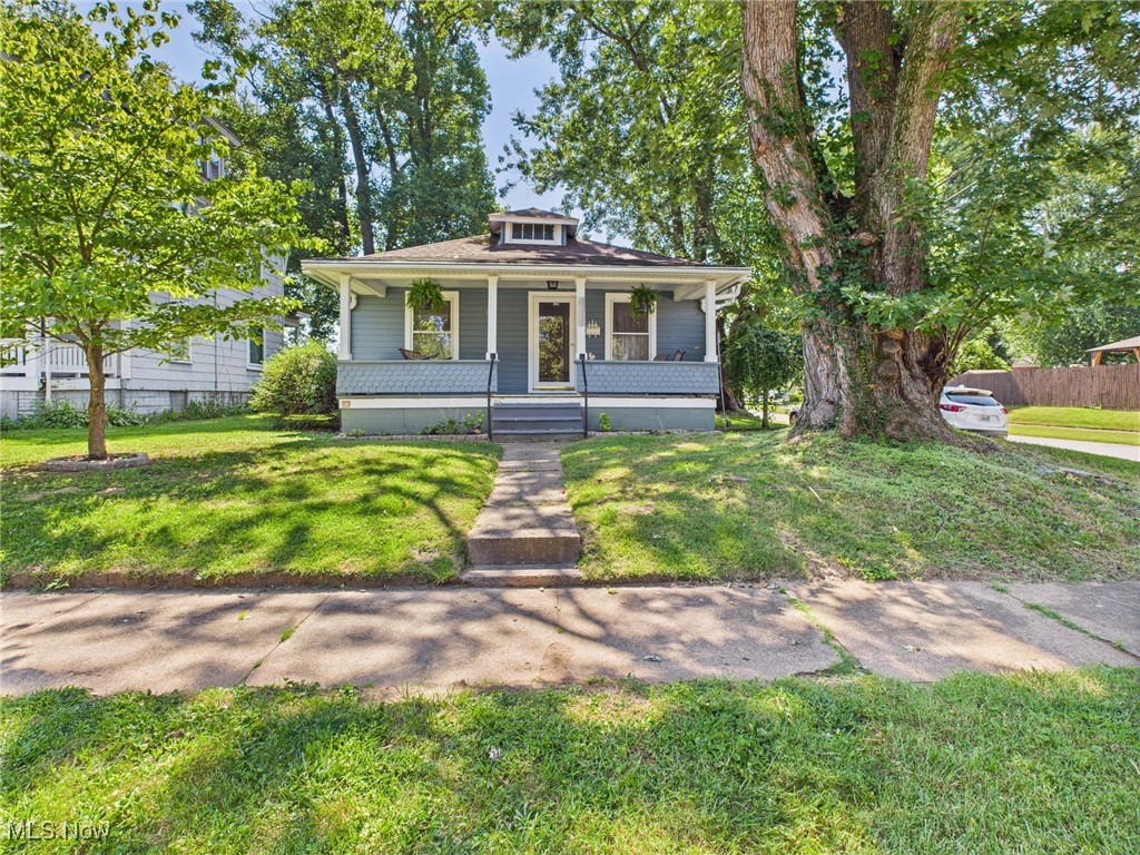 Welcome to the Blue Bungalow on the corner in a great Williamstown neighborhood. This home is move-in-ready and offers great space inside and out. Offer two bedrooms and two full bathrooms, a nice-sized kitchen with newer appliances, and plenty of cabinets/counter space. Outside, you will enjoy the covered front porch, nicely landscaped shady yard, and storage building/workshop for your projects. Home is being sold as-is, although no known defects. The Seller wishes to make no changes/upgrades.