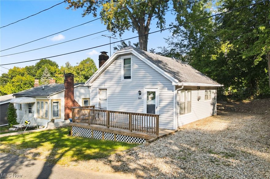 Cozy Portage Lakes Cape Cod!  This adorable RENOVATED home is the perfect place to relax at the lakes!  Whether you are looking for your own little slice of Lake Life or want to host your own short term rental - LOOK NO FURTHER!  Enjoy the treed area and views of the lake from the front deck - the perfect spot for morning coffee or to relax and read a book. Inside the galley kitchen is just the right size and has all the amenities you need including a stainless steel fridge.  The living room adjacent to the kitchen is just the spot to unwind and play games or stream the latest movie all while you curl up by a fire!  A full bathroom with new LVT and first floor laundry round off the main level of the home. Upstairs you'll find an oversized bedroom with cape ceilings.  There is plenty of space for a second bed or use the area for office space! Enjoy the evenings out back with a crackling fire in the fire pit. An outdoor shed is the perfect place to store personal items or seasonal toys l