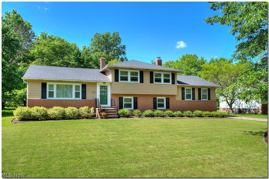 This home exudes pride of ownership. Some recent improvements include complete tear off and roof replacement in 2006, furnace in 2005, laminate wood style flooring in kitchen, cabinets repainted and new countertops in 2013, all new appliances in 2013, all new windows in Fall 2015, new sliding glass door in 2015, driveway installed, backyard cleared and all new landscape. From the moment you pull in the drive you will see how lovingly the present owners have maintained their home. The lower level bedroom is now used as an office. The family room has a beautiful brick wall fireplace, surrounded by built-in cabinets. The family walks out onto the patio and overlooks the beautiful back yard. This home is a gem.