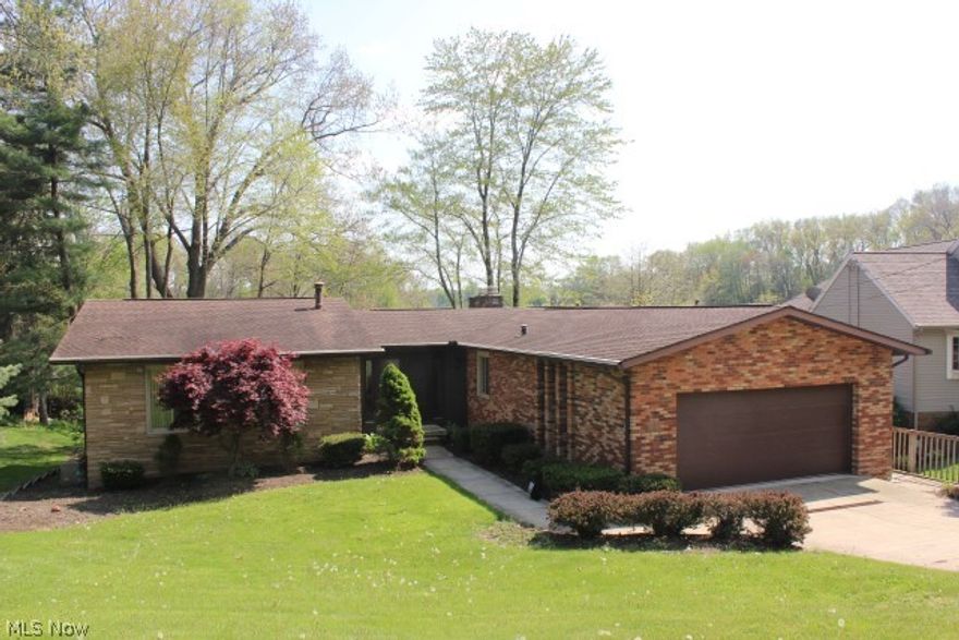 Best buy on Portage Lakes* A must see water front on main chain of Lakes w/4 bedrooms, 3 bath, approx. 3000SF including walk out lower level* Many updates including kitchen, 2 bath rooms, flooring (approx. 1yr.), windows, sliding doors, shingles, gutter guards, trex deck, central air, water heater, well pump & disposal (approx. 6 yrs.)* 
Vaulted living room w/stone gas log fireplace* Family room w/stone gas log fireplace & automatic heatilator* Library with French doors & wood floor* Office with private entrance* Laundry area w/cupboards & folding area* Glass block windows* Zoned heat* Central air* Sewer/private well* Garage plumbed for gas heater* Plumbed for gas grill* Brick patio* Outside shower* Recreation facilities- picnic pavilion, tennis court, playground* Immediate possession* Absolute move in*