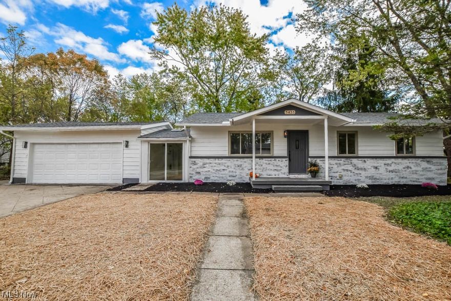This recently remodeled ranch-style home is a must-see! The updated interior boasts vinyl plank flooring that spans from the living room into the inviting kitchen, featuring a subway tile backsplash, quartz countertops, an undermount sink, and space for dining. A charming vaulted breezeway, equipped with a brand-new sliding door for easy access to both the front and backyard, connects the house to the spacious 2-car garage. Down the hallway, you'll find three bedrooms and a refreshed full bath with a tub, tiled shower surround, and a stylish shiplap accent wall. The finished lower level adds extra living space with a rec room, a fourth bedroom, and a designated laundry area. Outside, soak up the sun on the deck overlooking the backyard, complete with a shed for storage. The extended driveway is an added bonus, providing plenty of space for parking. Recent upgrades include a new roof, all new flooring, fresh paint, updated fixtures, patio doors, a newly poured concrete garage floor, and much more! Don't miss your chance – call to arrange a showing today!