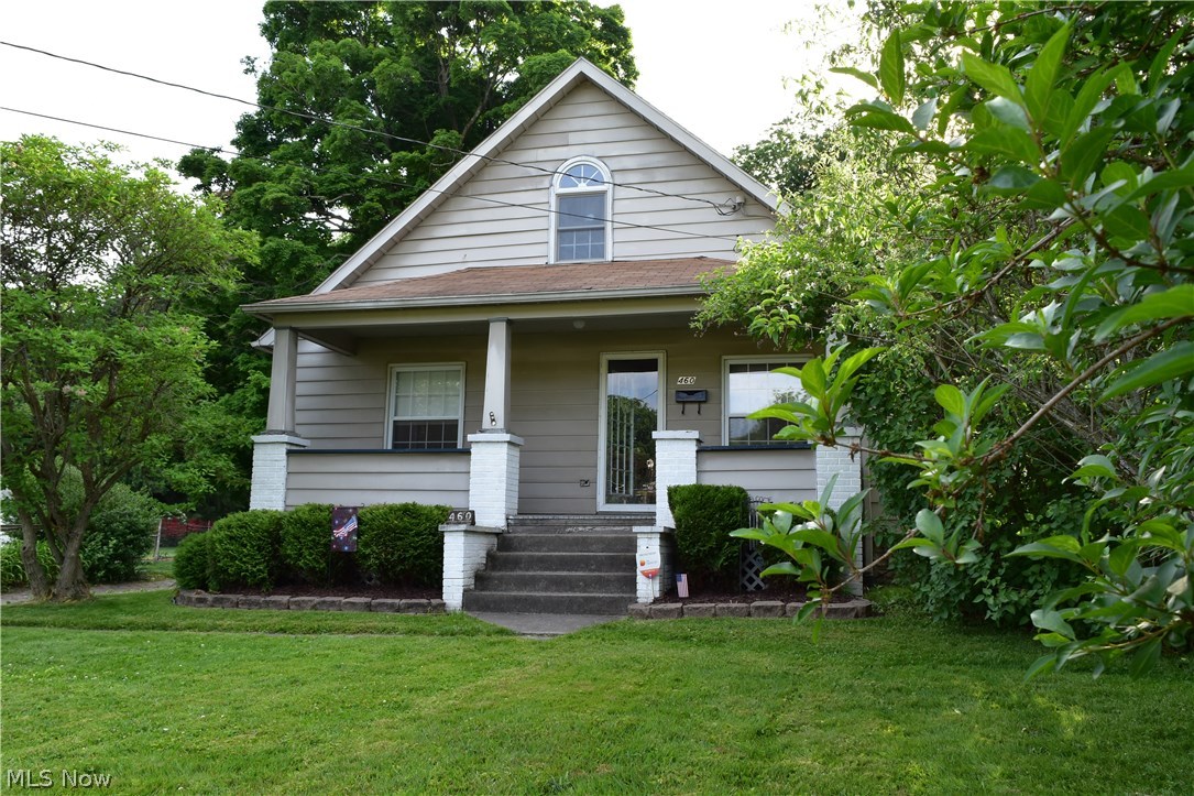 Come enjoy the serene park like setting that surrounds this adorable home. Enjoy your morning coffee on the front porch and evening snacks on the enclosed back patio. You will be welcomed by a generous sized living room with large windows. The updated kitchen offers plenty of storage, and tile flooring. Hold all of the family gatherings in the spacious dining room with stunning hardwood floors. This home also offers a first floor master bedroom, first floor full bathroom and half bath that houses the washer and dryer for extra convenience. There is a beautiful wooden staircase leading to the second floor which offers two good sized bedrooms and a full bath. This home boast a newer hot water tank, a three tab roof and central air for those hot summer days. Make your appointment to take a look, you will not be disappointed. Welcome Home!