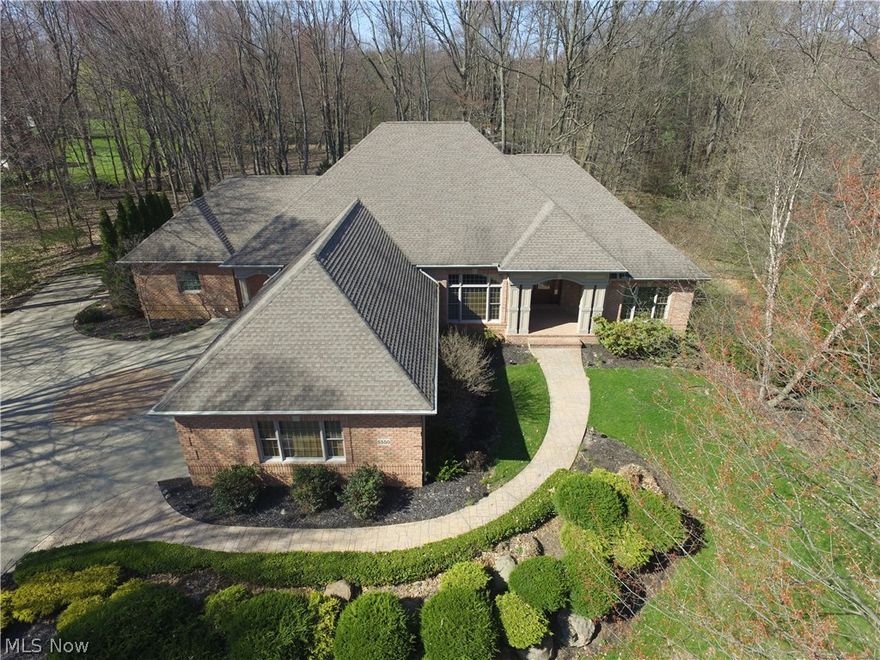 Fantastic opportunity to own this custom all brick ranch situated on 1.2 ac private lot!  You'll be amazed at the quality through out this beautiful home.   Hardwood floors on entire main level with cherry molding and built ins.  Gourmet kitchen with Viking appliances, double ovens, granite counters
and open to family room with fireplace and lots of windows.  Hand painted trayed ceiling in formal dining room and an office with French doors, built ins and beautiful ceiling.  Jack and Jill bath between bedrooms 2 and 3.  Master suite is 21x20 with sitting area, fireplace and spacious, elegant bath with tile, walk in shower, dual vanities and tub.  Large laundry room with tile floor and loads of storage, washer and dryer are included. Incredible lower level has an Exercise room and 4th bedroom with egress windows and a full bath. Game room, kitchenette, recreation area has pool table and built in cabinets. There is also a media room with built ins and a putting green. All nice and open a