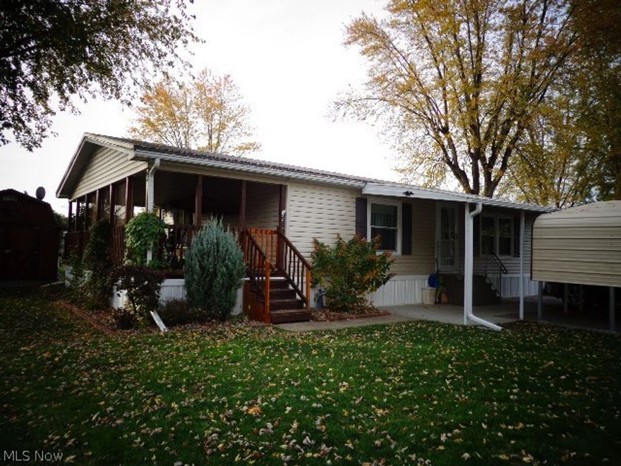 Great home for slowing down or starting up! Nothing to do here! Well maintained, beautiful 3 bedroom, 2 bath home with a covered porch. Current updates include all new doors and windows, a 40-year steel roof, new carpet and a new carport.  Large open living room with fireplace. 10X12 storage shed. 1-Year America's Preferred Home Warranty included.