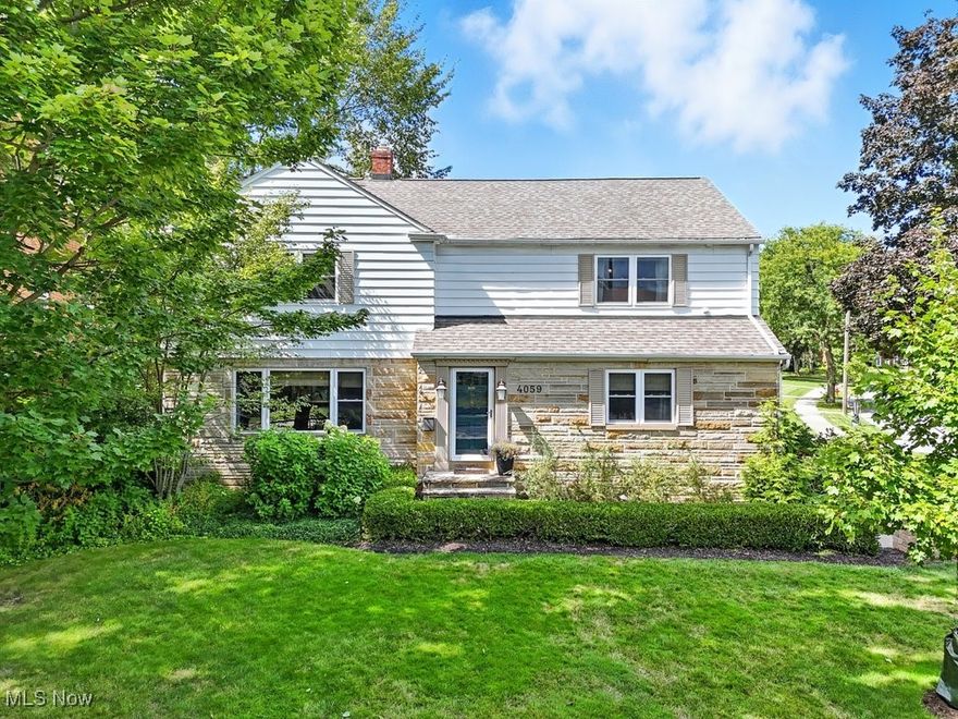 Nominated for a University Heights "Beautiful Home Award", this timeless colonial combines classic charm with modern updates in a prime location. Set on a rare and large double corner lot just steps from John Carroll University, the property is framed by freshly redesigned landscaping, including new arborvitaes and privet hedges for privacy.

Step inside to a light-filled dining room that sets the tone for welcoming gatherings. The updated kitchen features a gorgeous quartz island and countertops with seating (2020) and newer appliances (2022), opening seamlessly into a vaulted Great room with exposed wood beam, skylights and a new gas-insert fireplace for year-round comfort. From here, step out onto a small deck overlooking the backyard, which feels like a private garden oasis complete with a brick paver patio—perfect for relaxing or entertaining. A convenient first-floor laundry and an office with original built-ins round out the main level, all highlighted by rich hardwood floors.

Upstairs, the spacious primary suite offers a clawfoot soaking tub, glass shower, and large walk-in closet. Two additional bedrooms share a second full bath with updated fixtures that preserve the home’s vintage charm. A hidden bonus: a large unfinished attic, offering excellent potential for future living space.

The lower level includes a partially finished recreation room plus a large blank-slate basement ready to expand further. An attached two-car garage provides plenty of storage. Recent upgrades include a new roof (2019), water heater (2019), water softener (2019), patio (2018), new garage door (2015), windows in the front and second floor (2015), blinds for the skylights, and a new electrical panel (2022). A one-year Home Warranty is provided by the Seller to the Buyer for peace of mind.

With its inviting design, thoughtful improvements, and unbeatable location in the shadow of John Carroll, this move-in ready gem is truly one of University Heights’ finest.